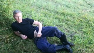 The farmer in boots peeing lying down in the pasture - porn video